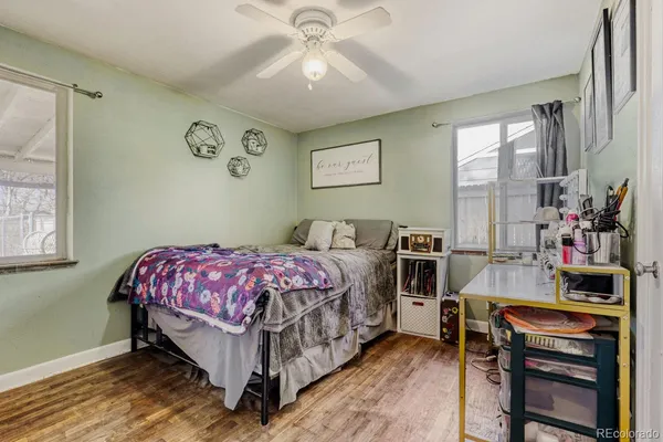 a bedroom with a bed and a table in it