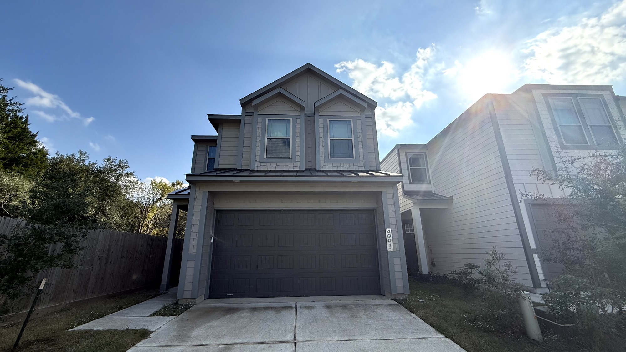 a front view of a house with garage