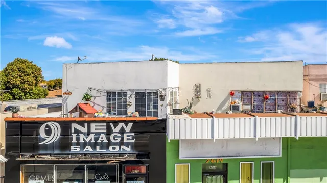 a view of a wooden house with a street