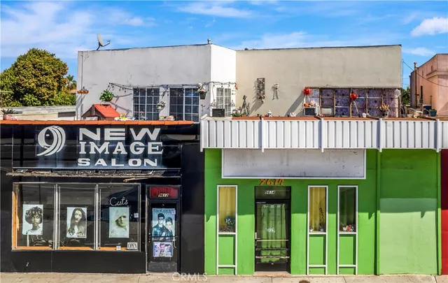 a front view of a building with glass windows and door