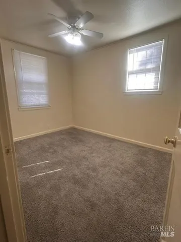 a view of empty room with windows