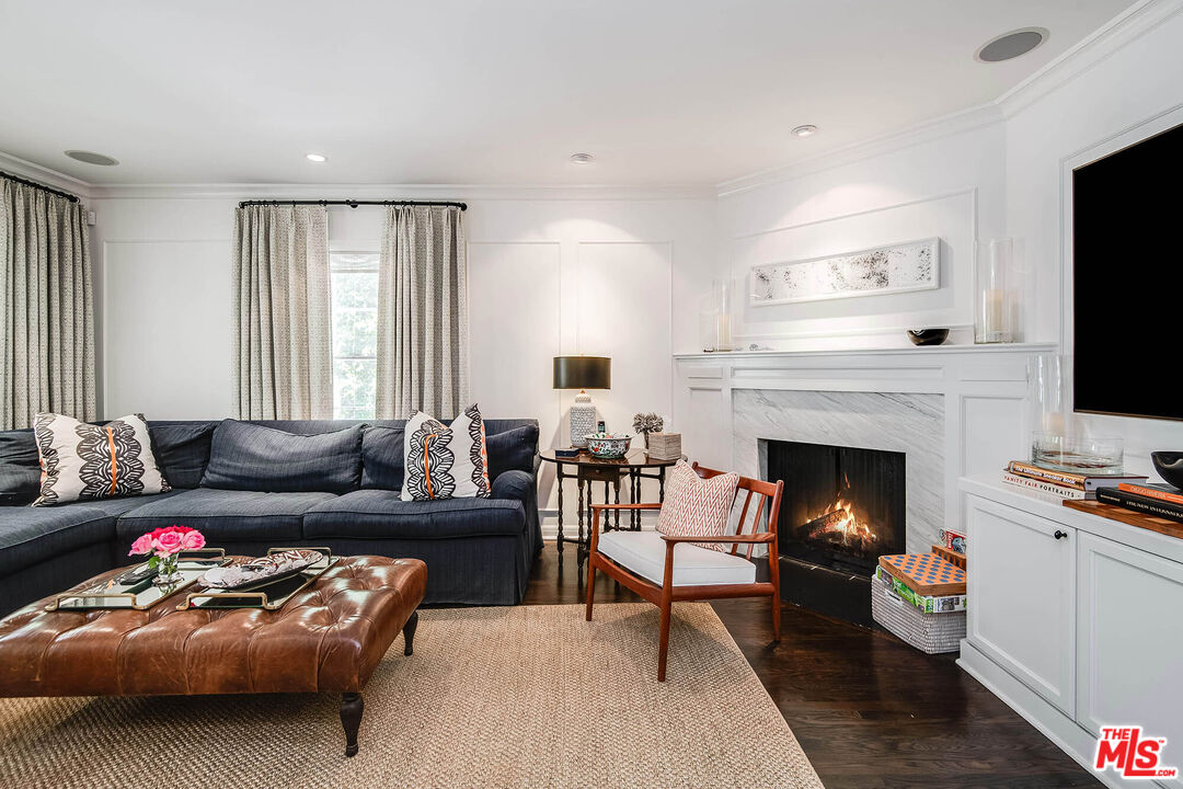2755 McConnell Drive Los Angeles, CA 90064 - Photo 15 of 47 a living room with furniture a flat screen tv and a fireplace
