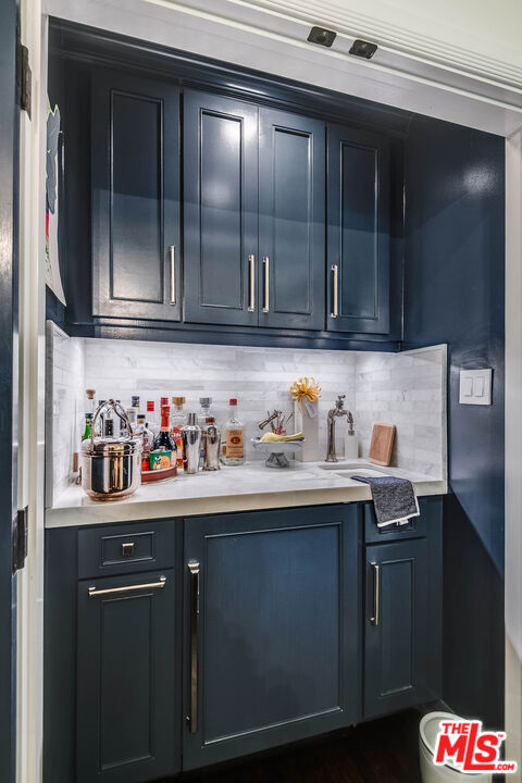 2755 McConnell Drive Los Angeles, CA 90064 - Photo 20 of 47 a kitchen with granite countertop a sink and cabinets