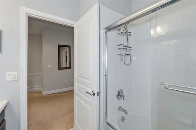 a bedroom that has a bed and a chair in it