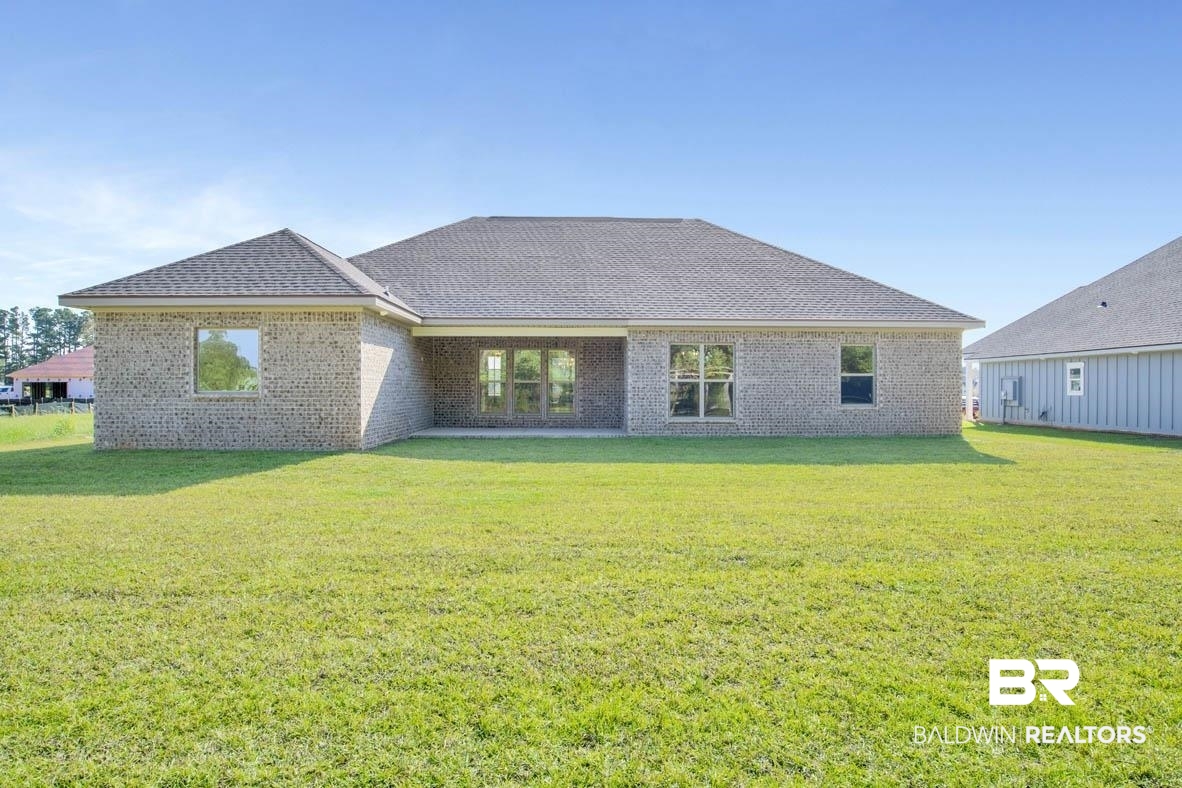 393 Garrison Boulevard Fairhope, AL 36532 - Photo 5 of 40 Rear view of property with a yard