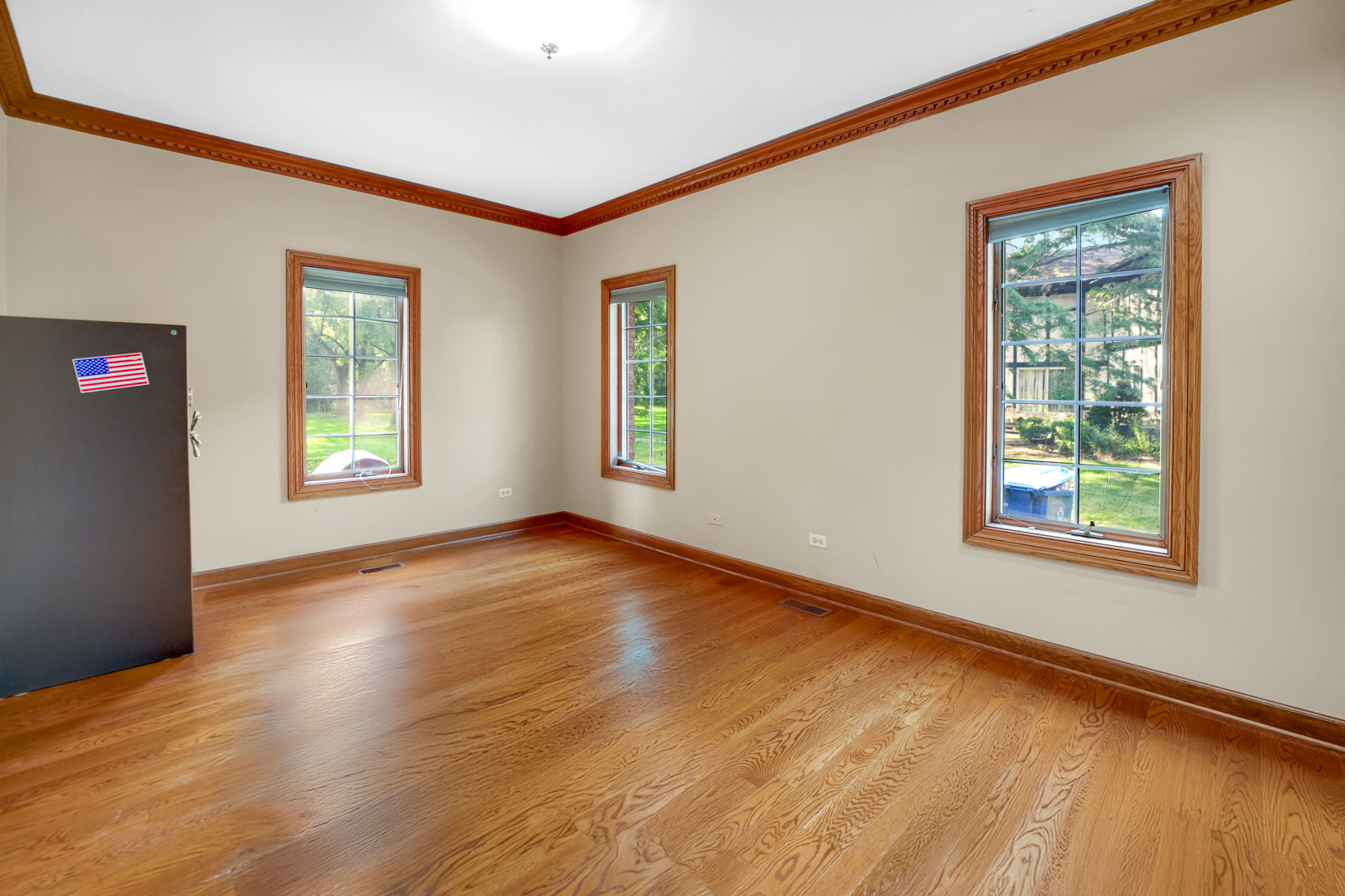 1816 Princeton Road Flossmoor, IL 60422 - Photo 12 of 26 a view of an empty room with window and wooden floor