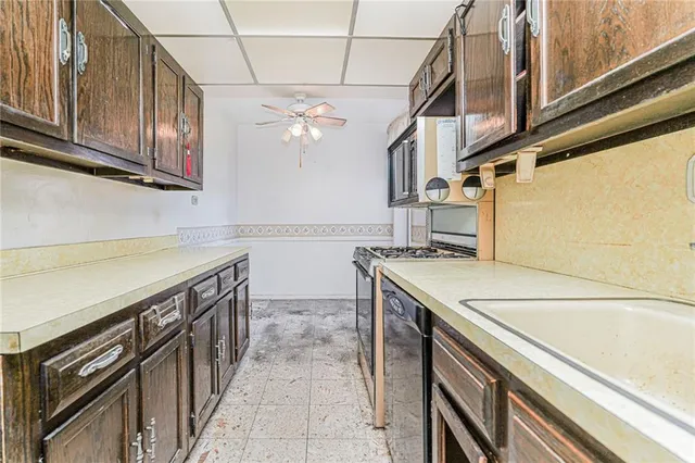 a kitchen with stainless steel appliances granite countertop a sink and cabinets