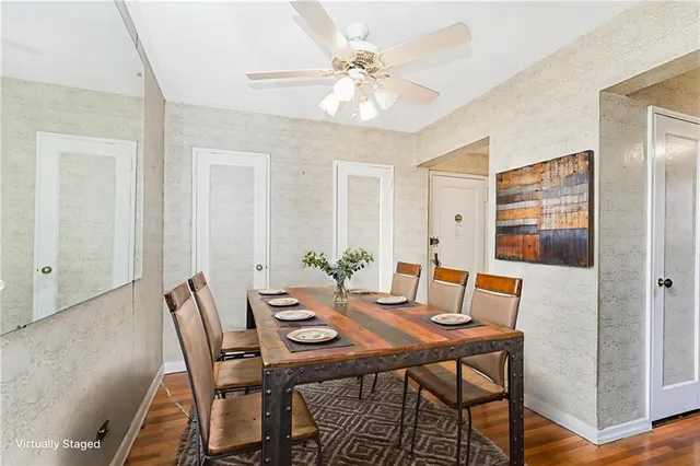 a view of a dining room with furniture and wooden floor