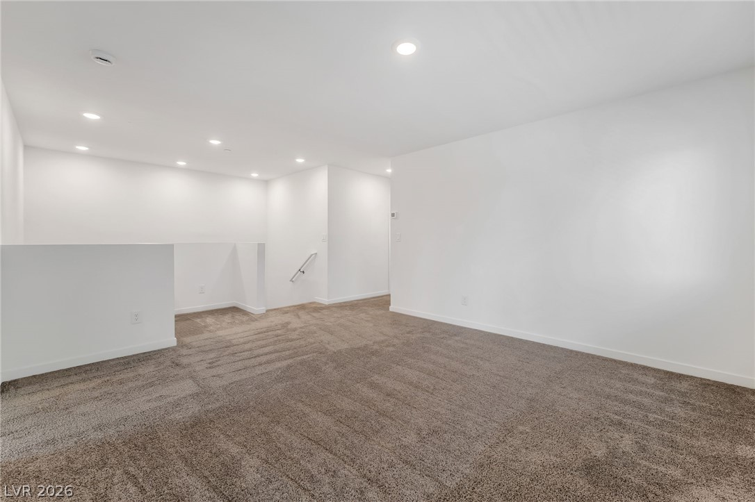 894 Cadence View Way Henderson, NV 89011 - Photo 12 of 23 Recessed lighting illuminates this versatile bonus room, perfect for any use.