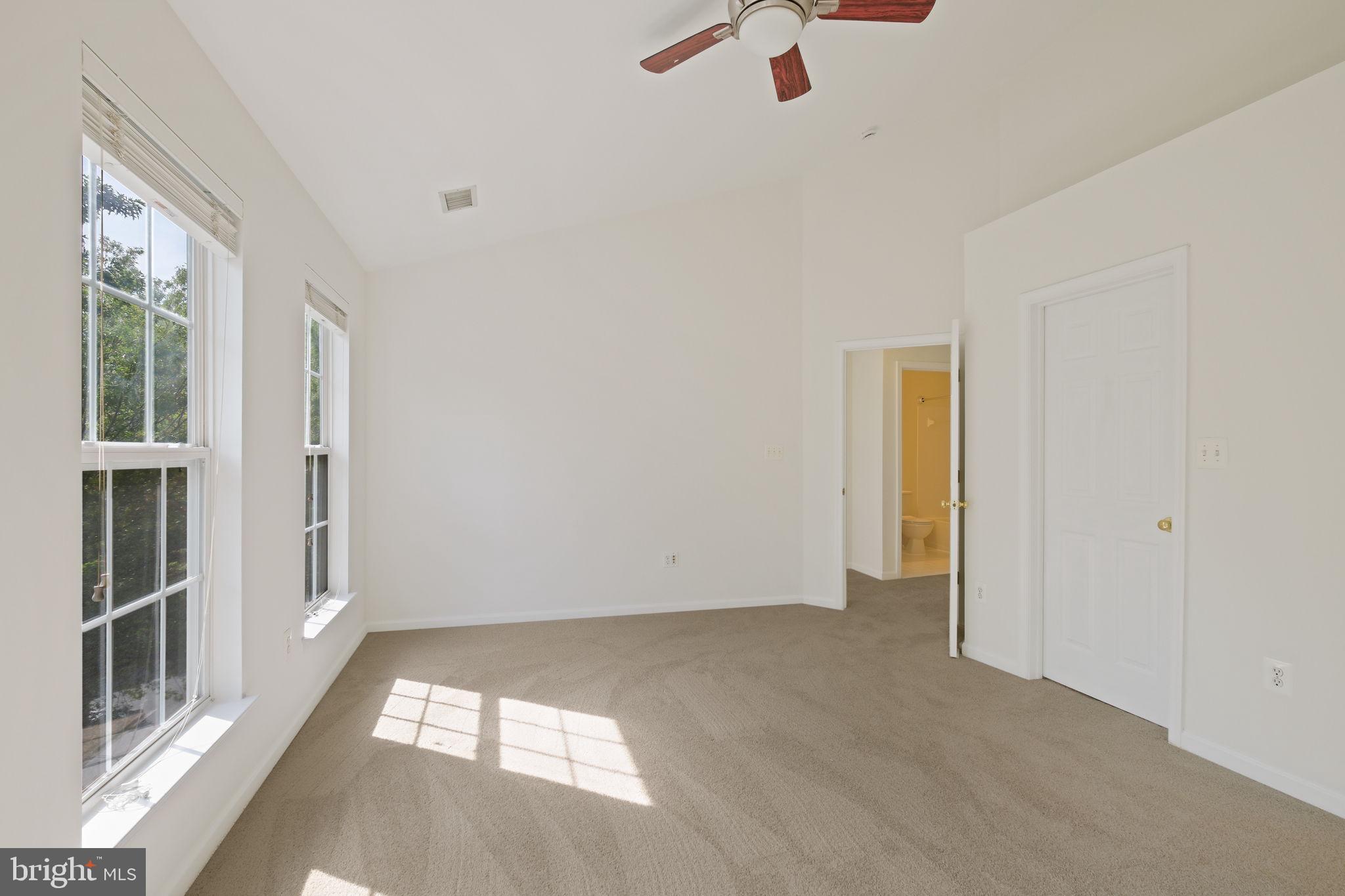 719 Main Street, Unit 719B Gaithersburg, MD 20878 - Photo 18 of 43 an empty room with windows