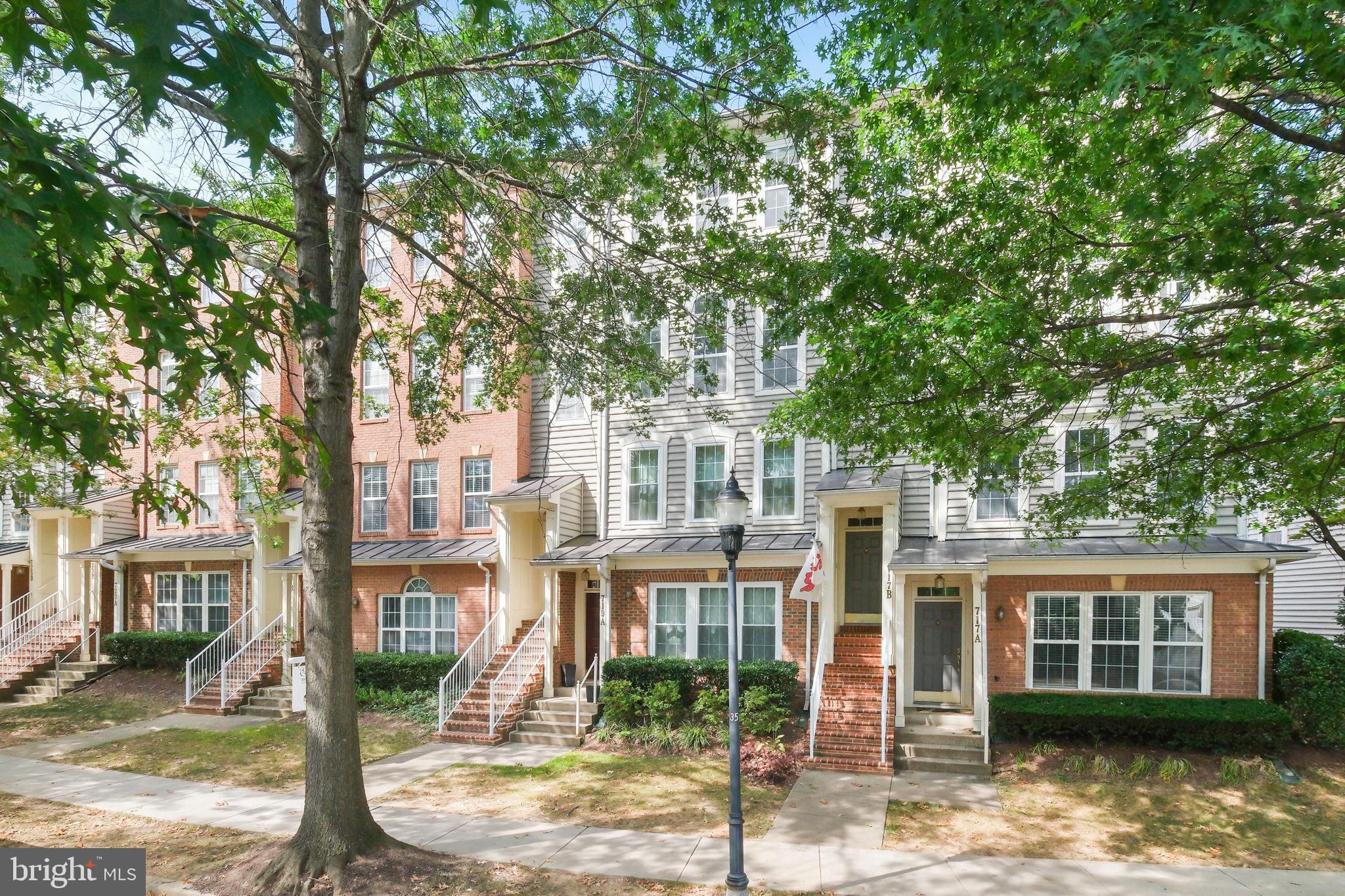 719 Main Street, Unit 719B Gaithersburg, MD 20878 - Photo 2 of 43 front view of a house with a tree in front