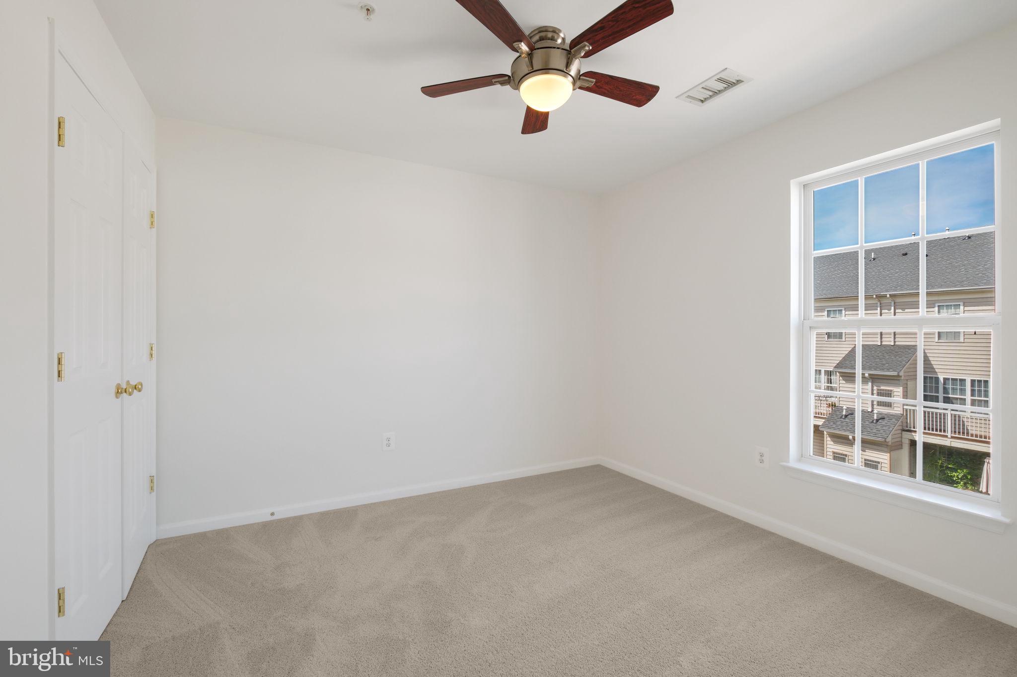 719 Main Street, Unit 719B Gaithersburg, MD 20878 - Photo 21 of 43 an empty room with windows