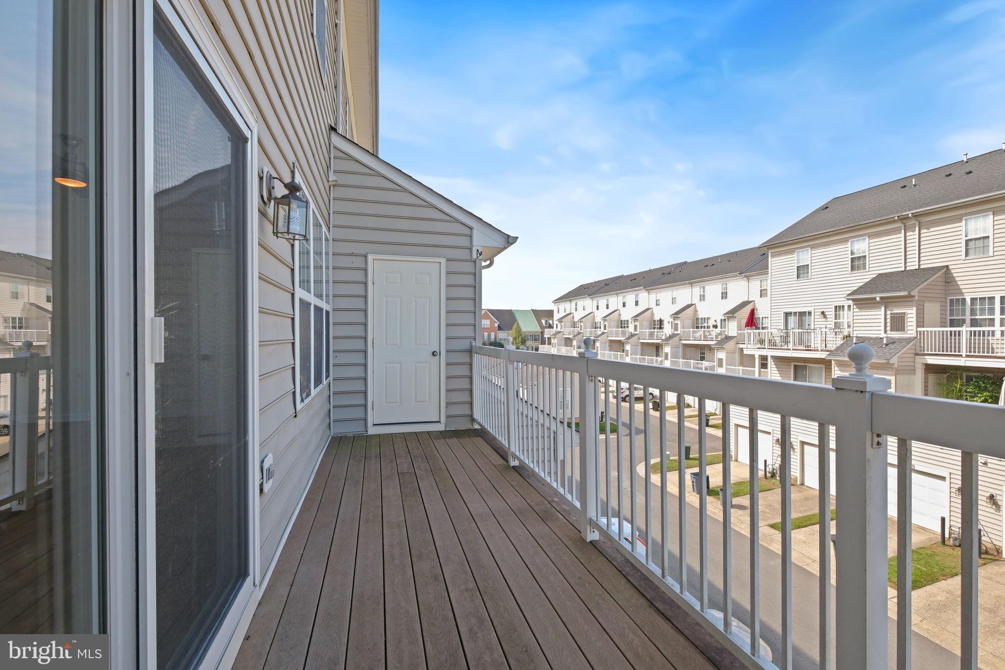 719 Main Street, Unit 719B Gaithersburg, MD 20878 - Photo 28 of 43 a view of a balcony with wooden floor