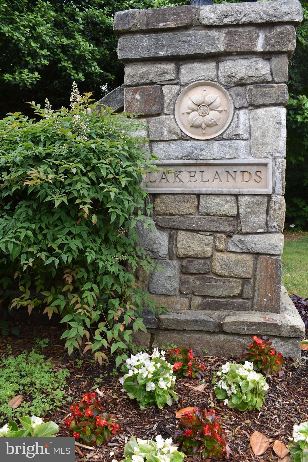 719 Main Street, Unit 719B Gaithersburg, MD 20878 - Photo 29 of 43 a view of a fruit stand with a lot of flower in a yard