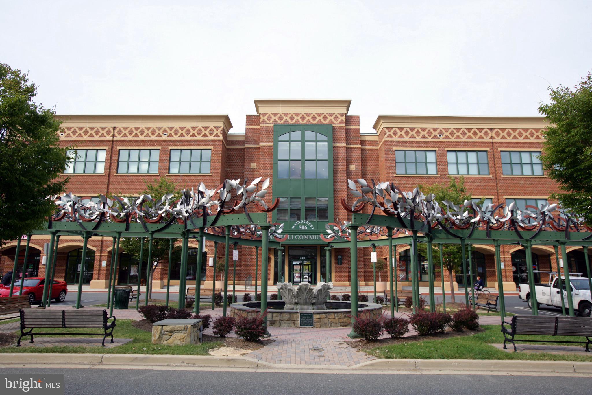719 Main Street, Unit 719B Gaithersburg, MD 20878 - Photo 37 of 43 a front view of a building and car parked