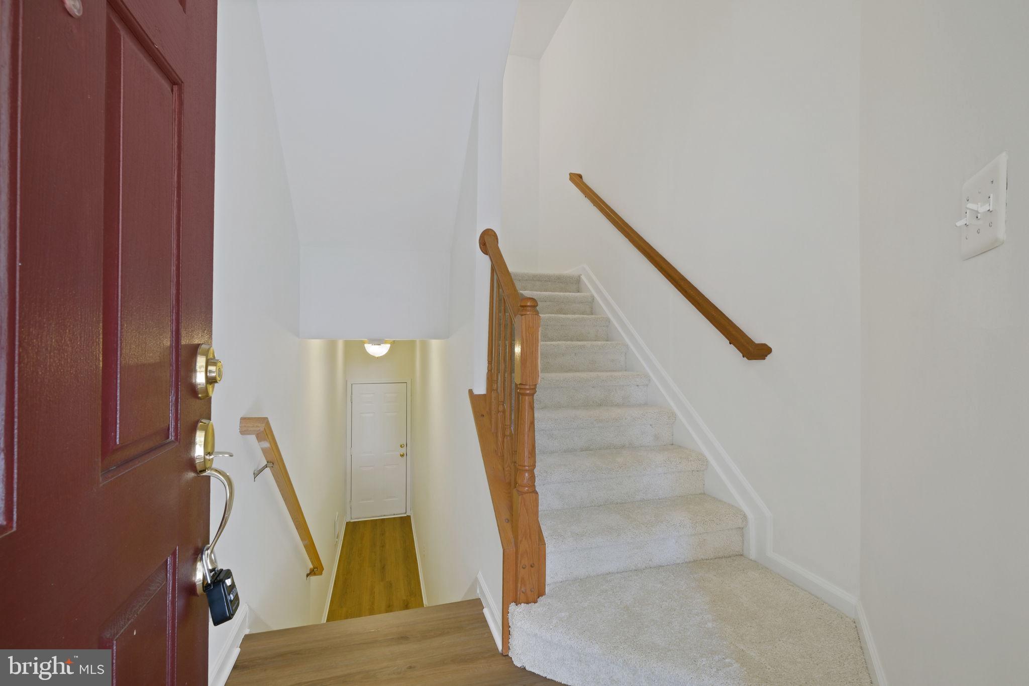 719 Main Street, Unit 719B Gaithersburg, MD 20878 - Photo 4 of 43 a view of entryway and hall with wooden floor