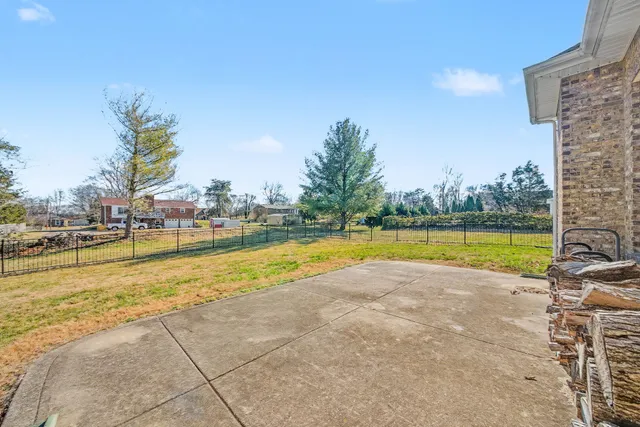 a view of a swimming pool and a yard