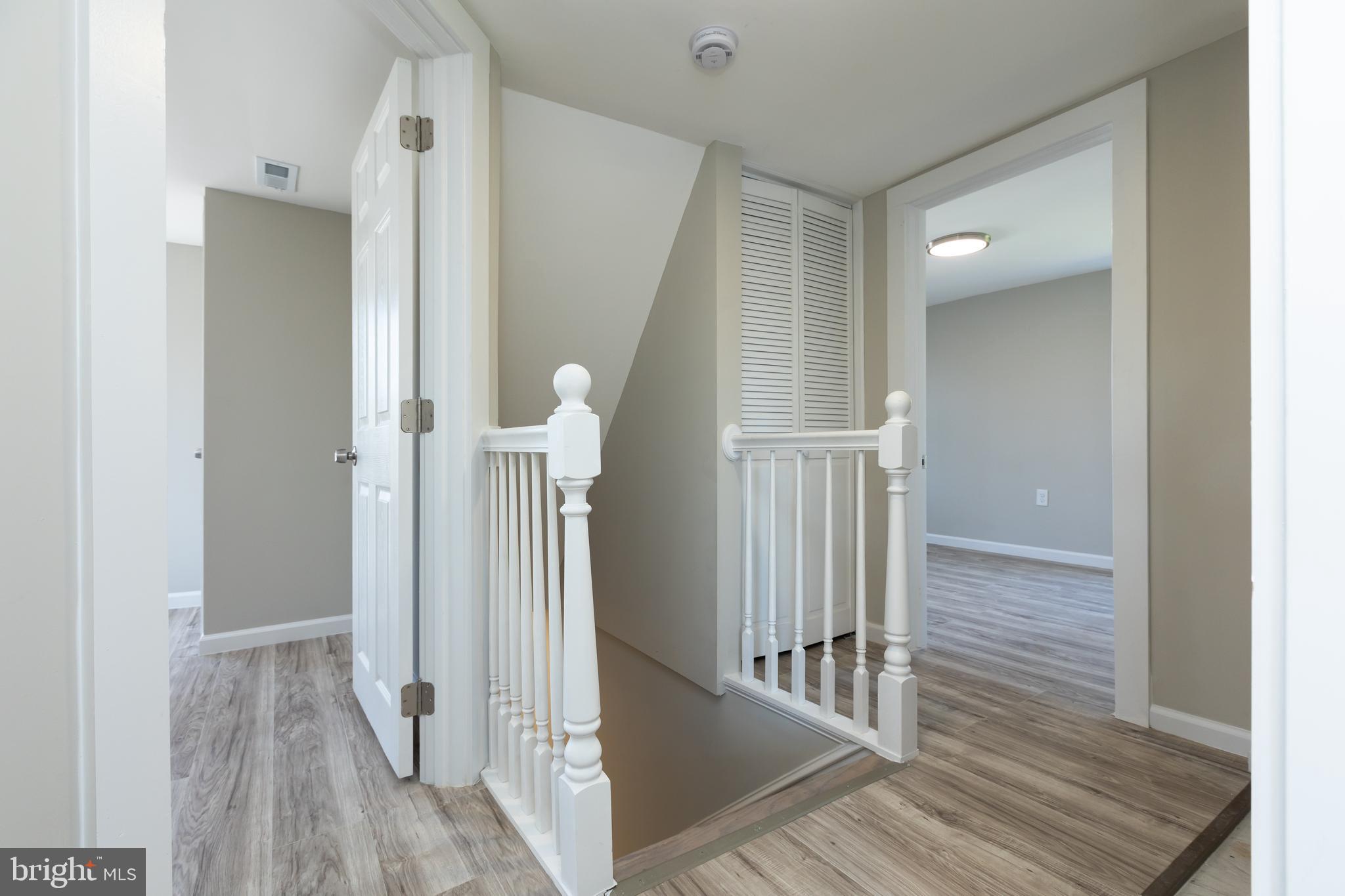 2407 Hammonds Ferry Road Halethorpe, MD 21227 - Photo 41 of 43 a view of a hallway view with wooden floor and staircase
