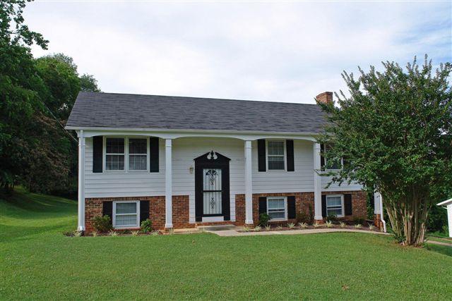 1608 Indian Rock Road Roanoke, VA 24014 - Photo 1 of 37 a front view of a house with a garden