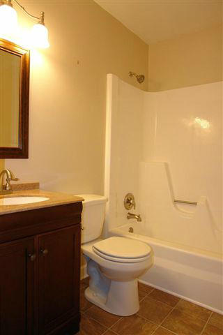 1608 Indian Rock Road Roanoke, VA 24014 - Photo 23 of 37 a bathroom with a toilet sink and mirror