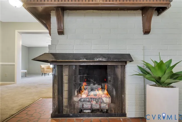 a living room with a bed furniture and a window