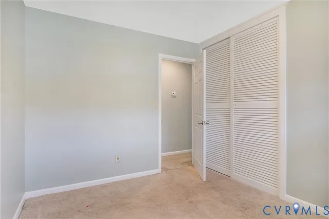 a bathroom with a sink a toilet and a shower curtain