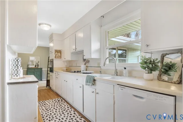 a kitchen with a sink and cabinets