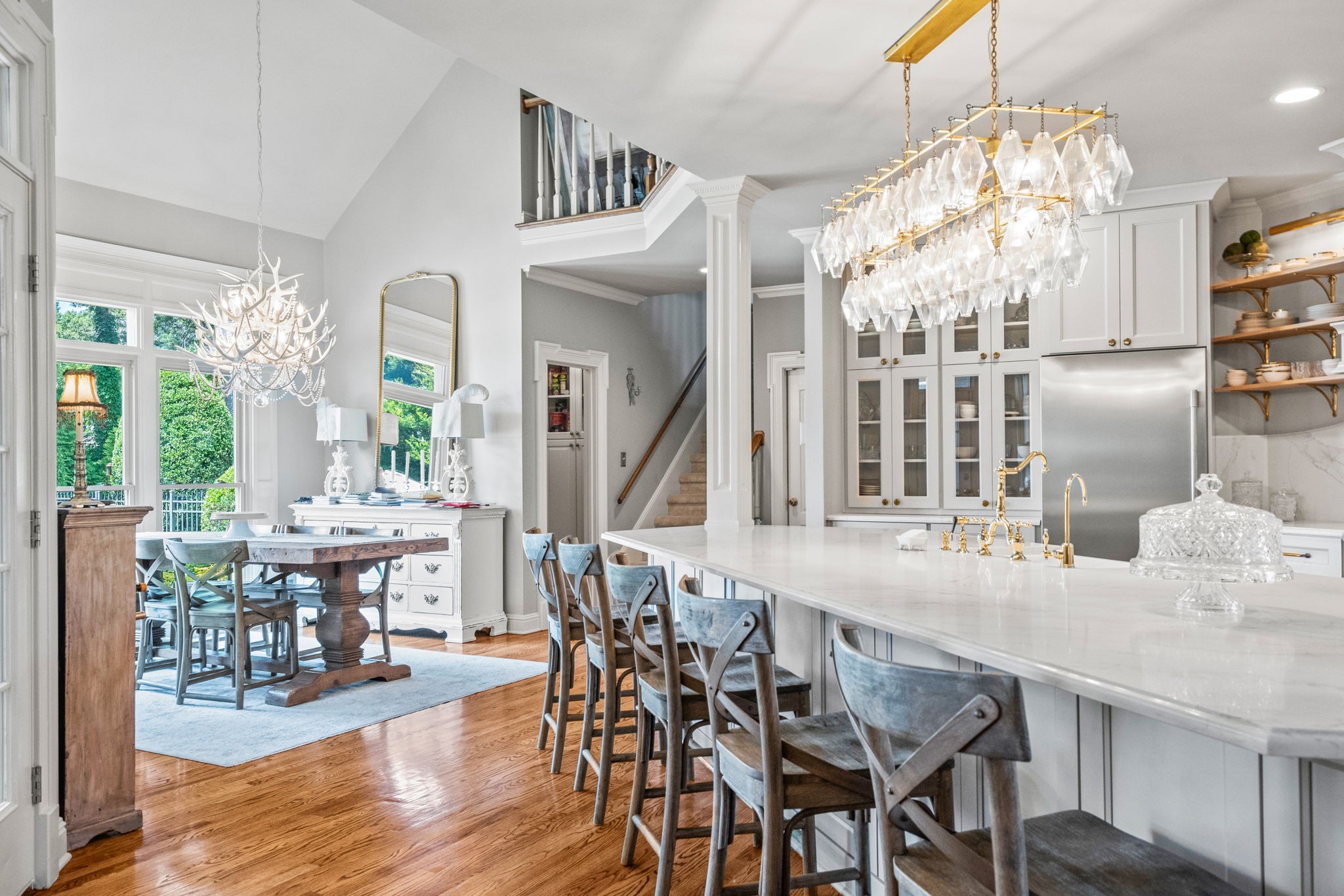 104 Riva Ridge Hendersonville, TN 37075 - Photo 15 of 66 a dining room with wooden floor a chandelier a wooden table and chairs