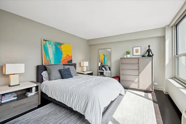 a bedroom with a bed and a dresser