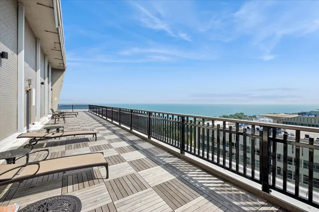 a view of balcony with wooden floor