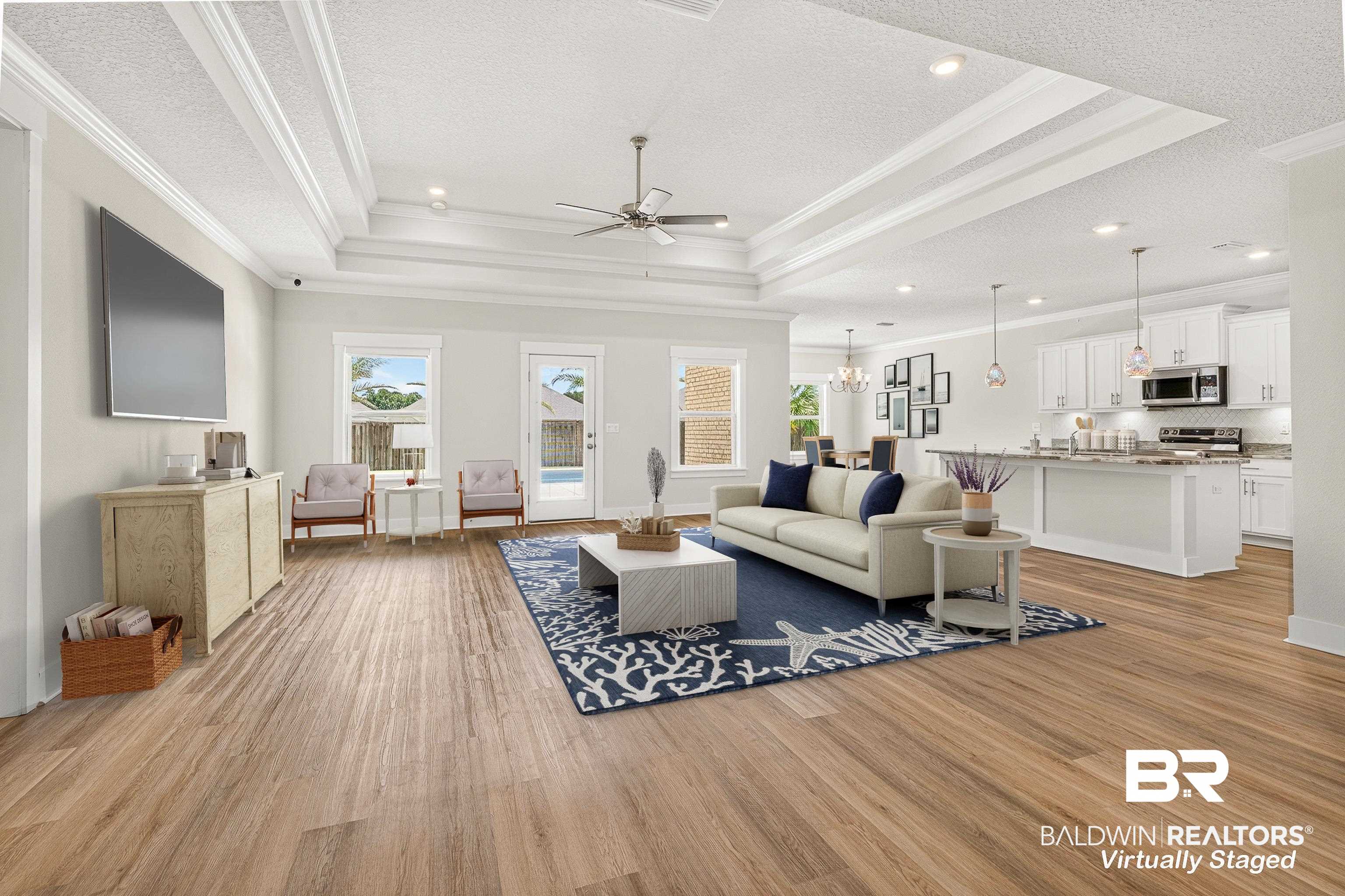 1724 Partridge Street Foley, AL 36535 - Photo 24 of 62 Expansive living area featuring wood-finish flooring, a tray ceiling, and recessed lighting