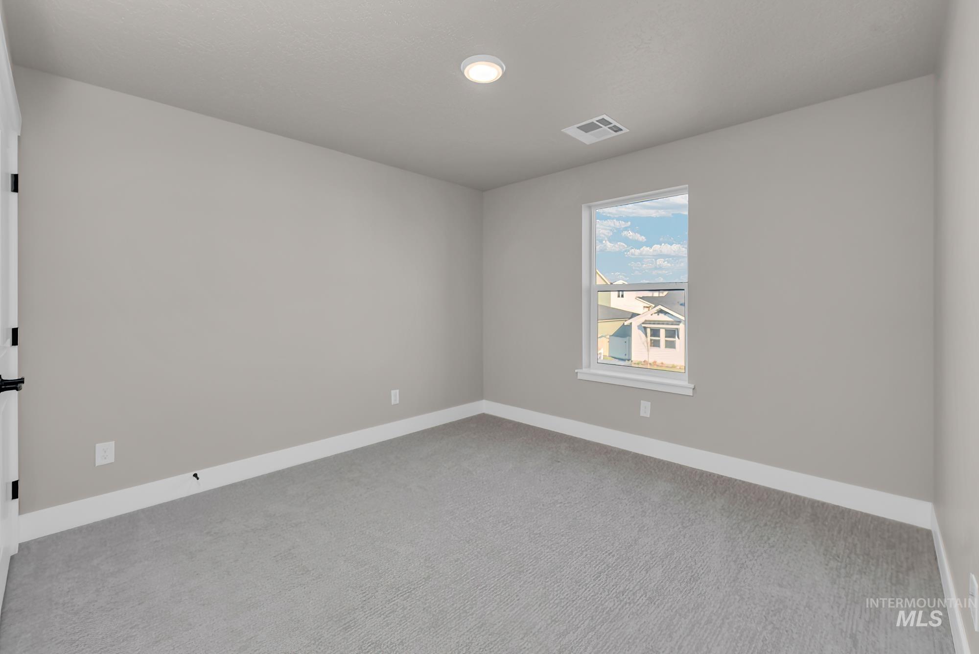 2807 West Jutland Street Meridian, ID 83642 - Photo 11 of 25 Carpeted empty room with baseboards