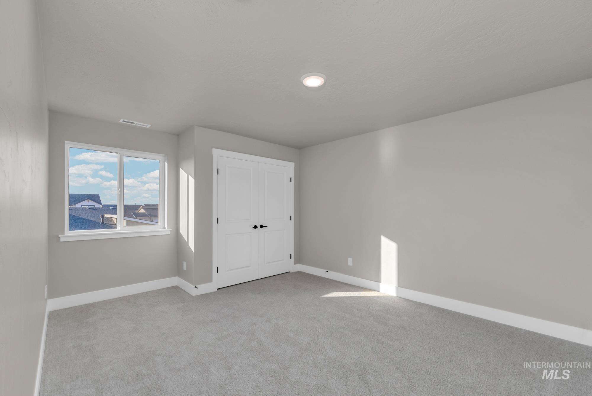 2807 West Jutland Street Meridian, ID 83642 - Photo 22 of 25 Unfurnished bedroom with carpet flooring and a closet