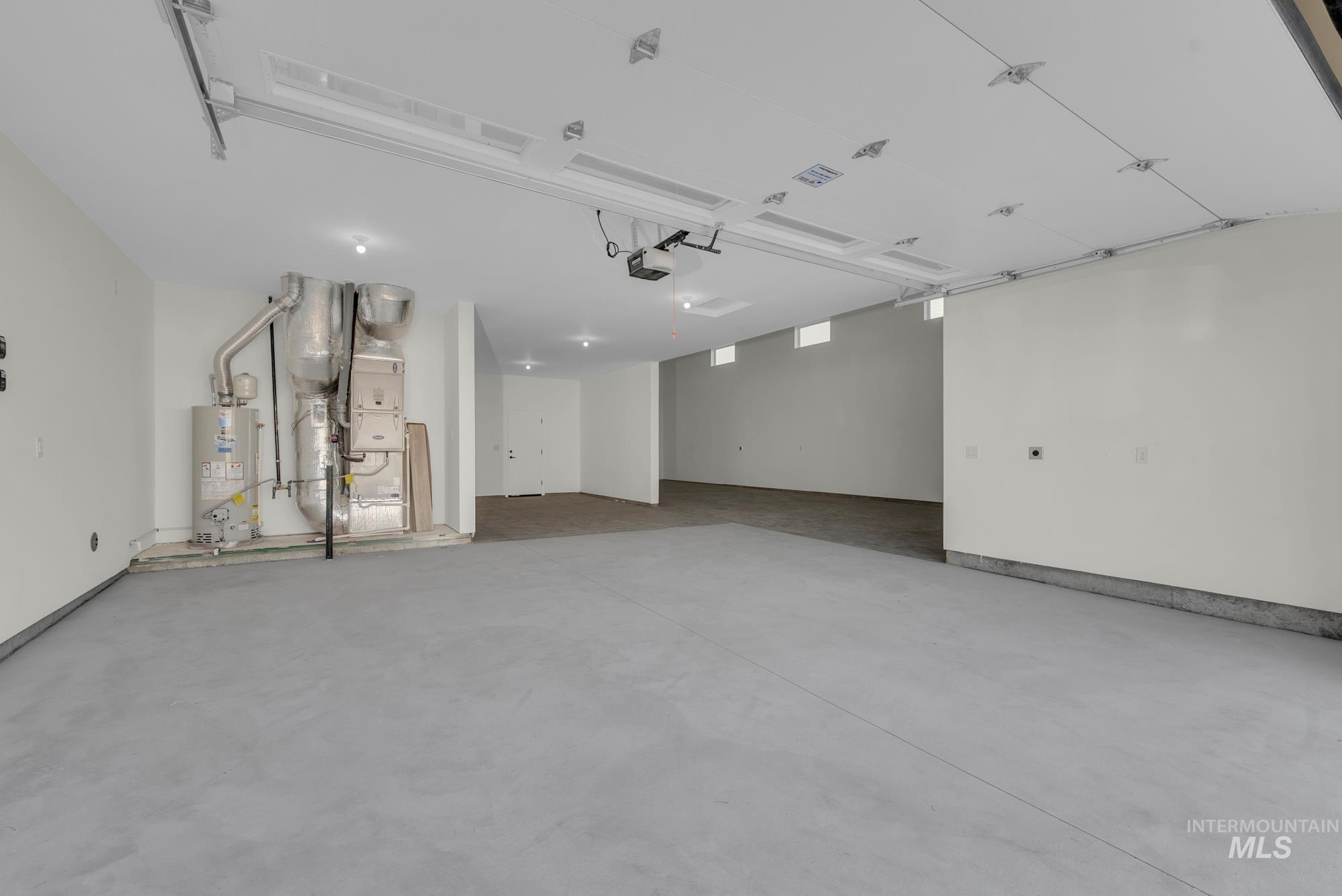 2807 West Jutland Street Meridian, ID 83642 - Photo 23 of 25 Garage featuring water heater and heating unit