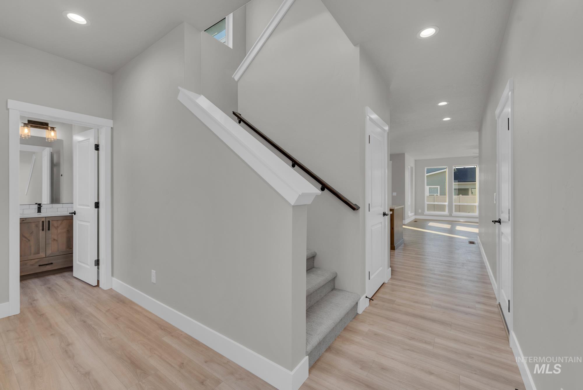 2807 West Jutland Street Meridian, ID 83642 - Photo 7 of 25 Staircase featuring recessed lighting and wood finished floors