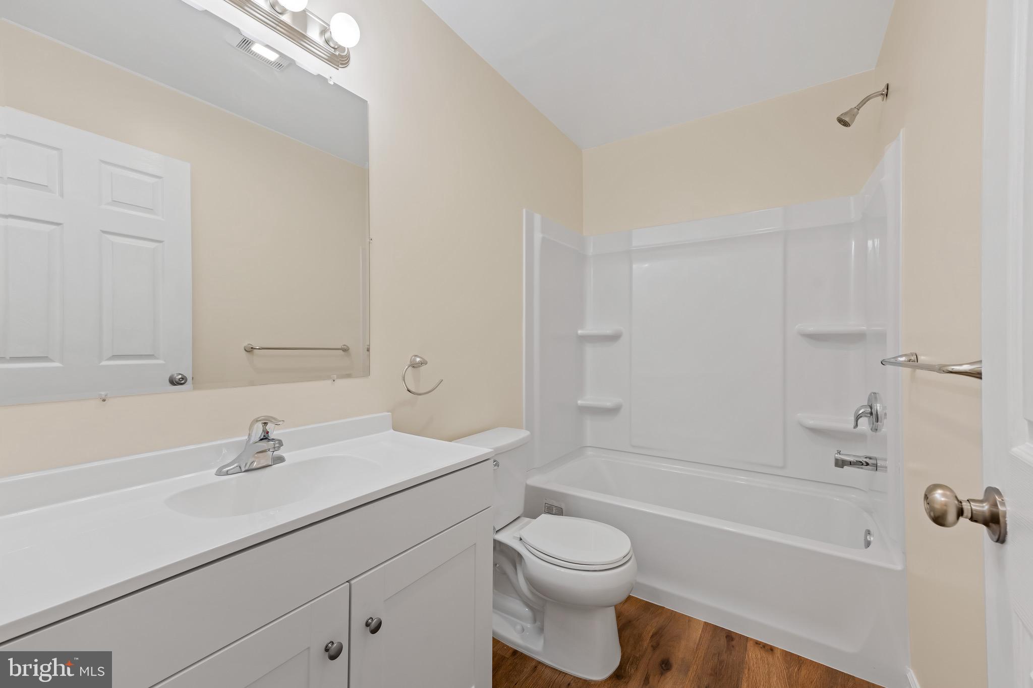 1488 North Tuckahoe Road Williamstown, NJ 08094 - Photo 11 of 27 a bathroom with a sink a toilet and a bathtub