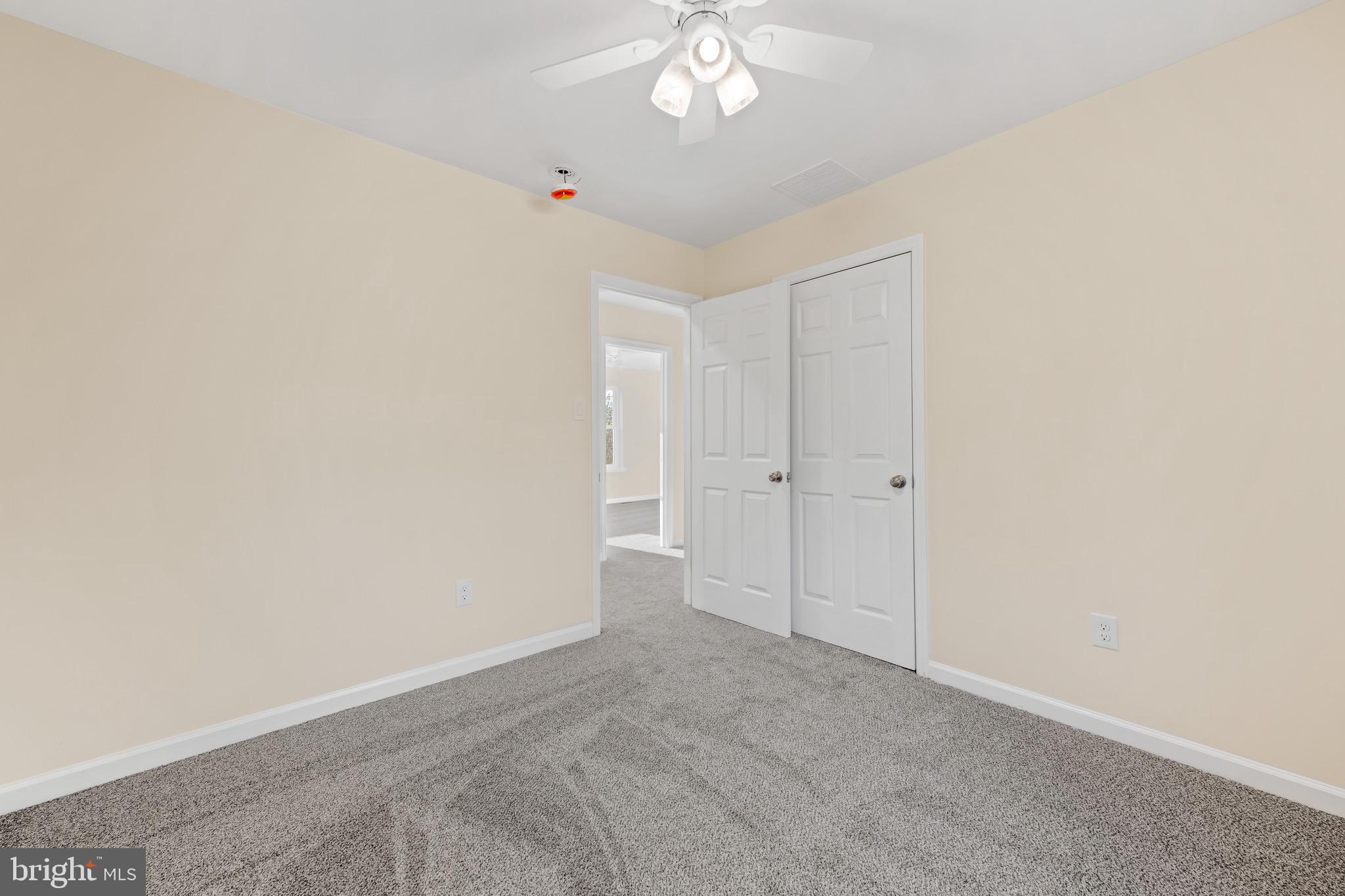 1488 North Tuckahoe Road Williamstown, NJ 08094 - Photo 13 of 27 a view of an empty room with a chandelier fan