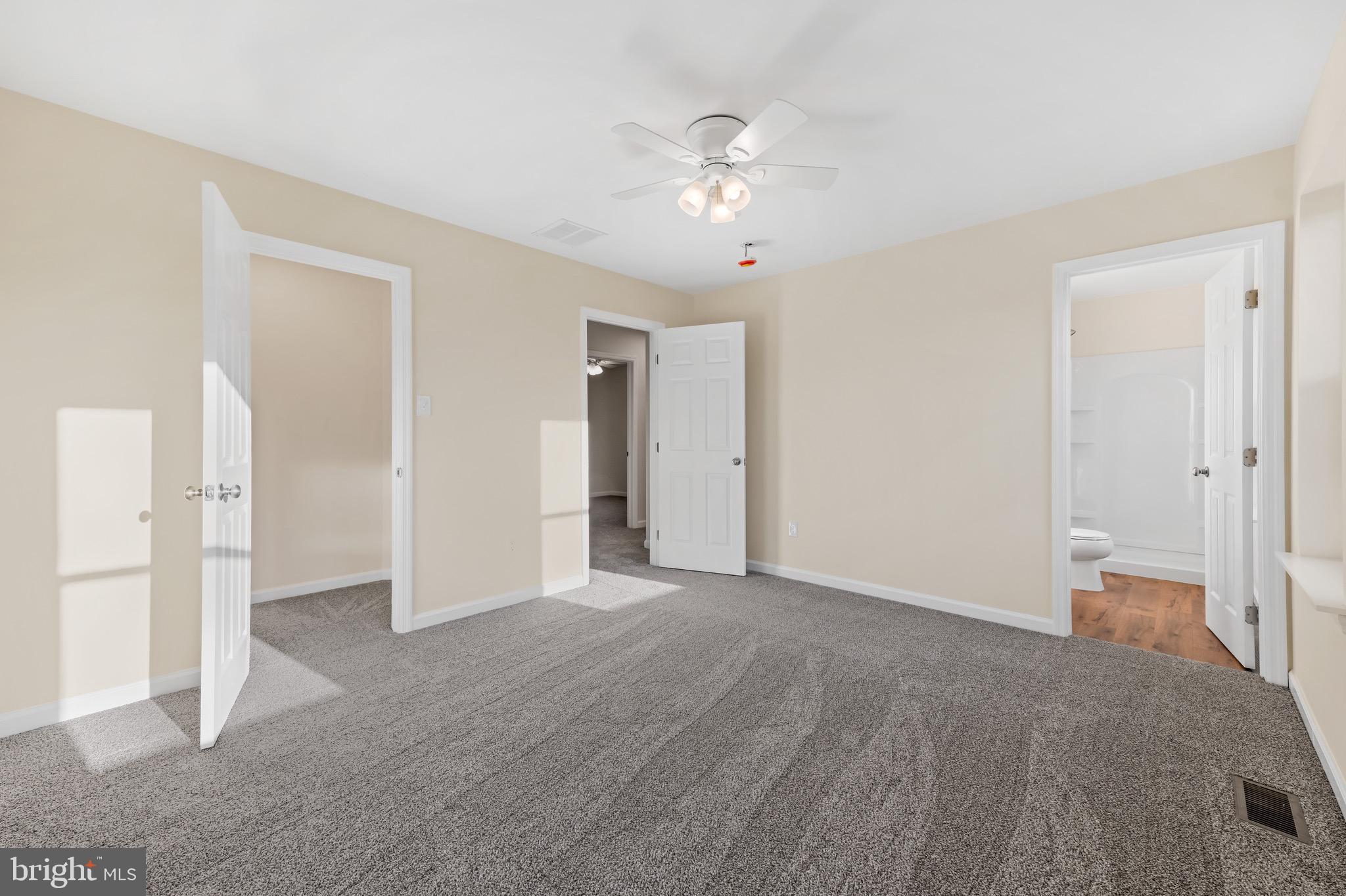 1488 North Tuckahoe Road Williamstown, NJ 08094 - Photo 17 of 27 a view of a livingroom with a chandelier fan and closet area