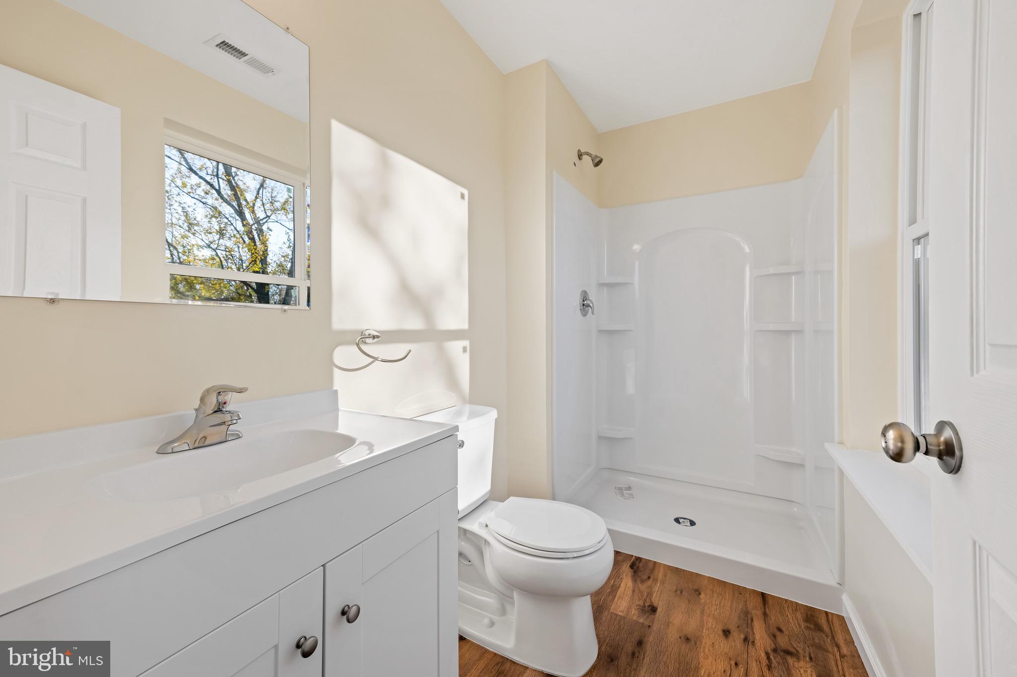 1488 North Tuckahoe Road Williamstown, NJ 08094 - Photo 18 of 27 a bathroom with a sink a toilet and shower