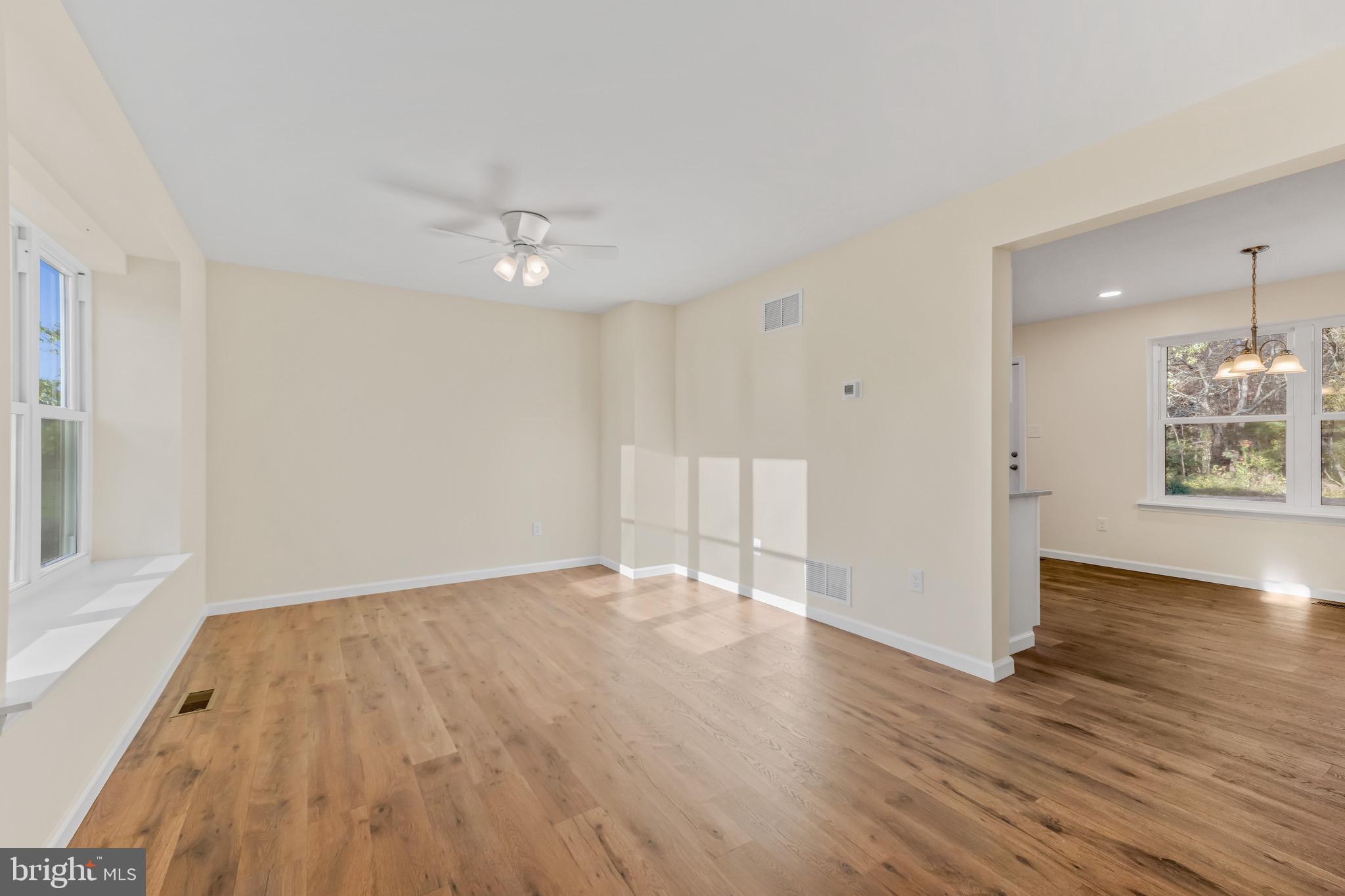 1488 North Tuckahoe Road Williamstown, NJ 08094 - Photo 5 of 27 wooden floor in an empty room with a window