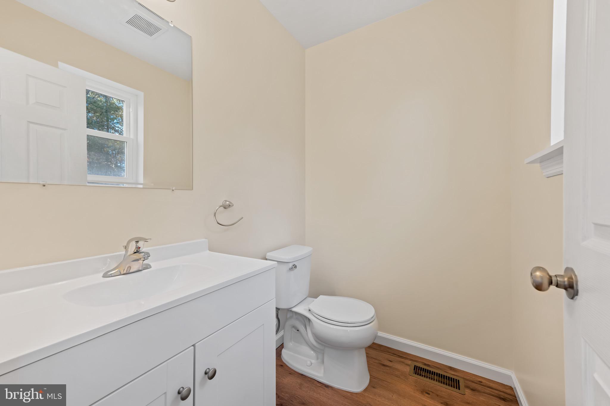 1488 North Tuckahoe Road Williamstown, NJ 08094 - Photo 10 of 27 a bathroom with a sink mirror and toilet