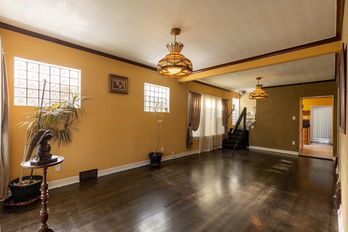 6840 29th Place Berwyn, IL 60402 - Photo 11 of 32 a view of a livingroom with wooden floor and a window