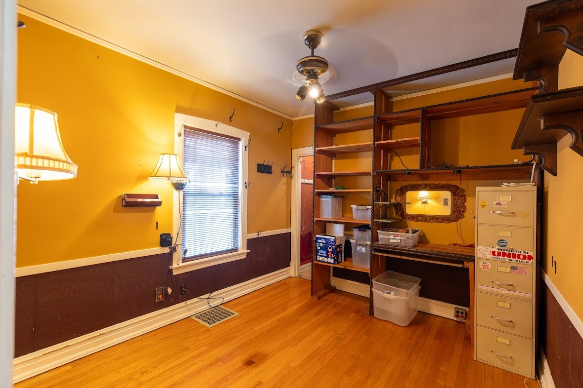 6840 29th Place Berwyn, IL 60402 - Photo 18 of 32 a living room with furniture and a flat screen tv