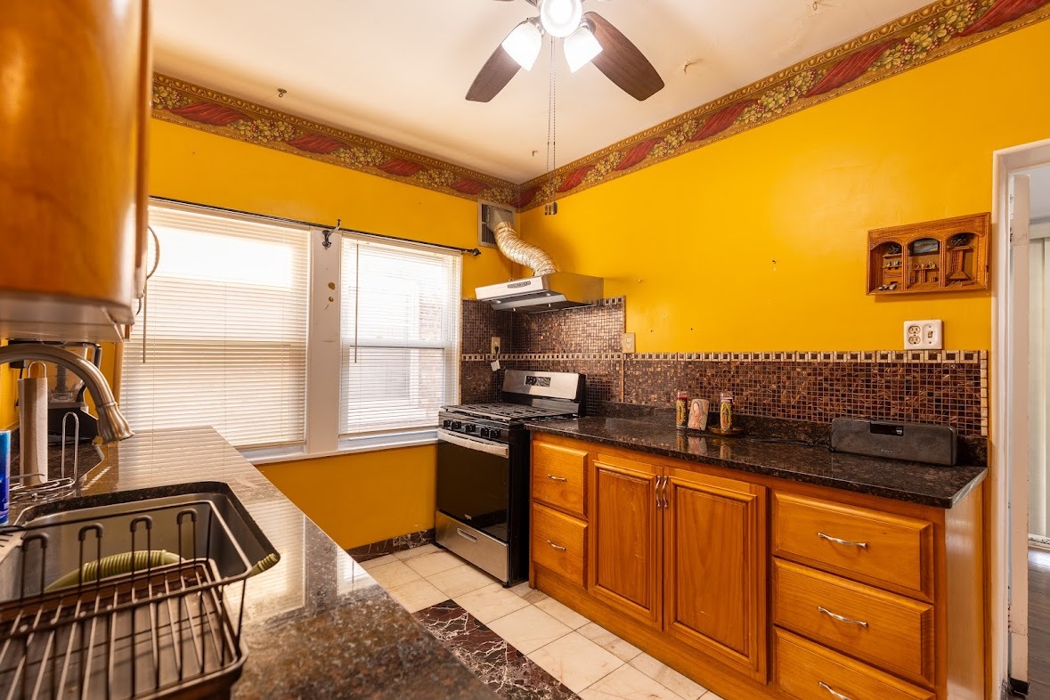 6840 29th Place Berwyn, IL 60402 - Photo 2 of 32 a view of a kitchen with a sink and cabinets