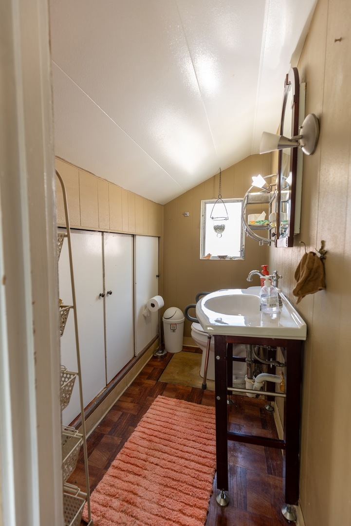 6840 29th Place Berwyn, IL 60402 - Photo 23 of 32 a bathroom with a sink a toilet and mirror
