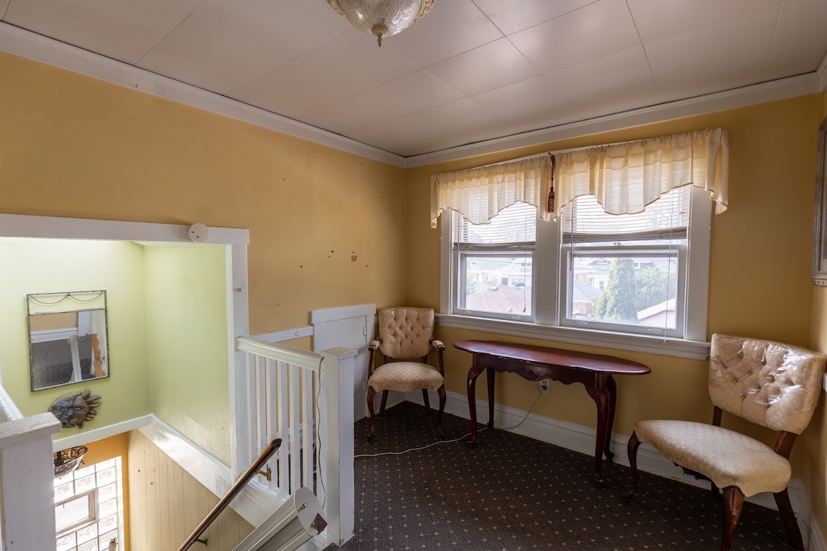 6840 29th Place Berwyn, IL 60402 - Photo 24 of 32 a living room with furniture and a window