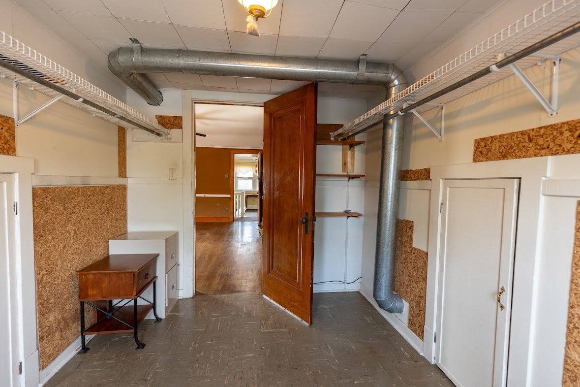 6840 29th Place Berwyn, IL 60402 - Photo 26 of 32 a view of hallway with furniture and a refrigerator