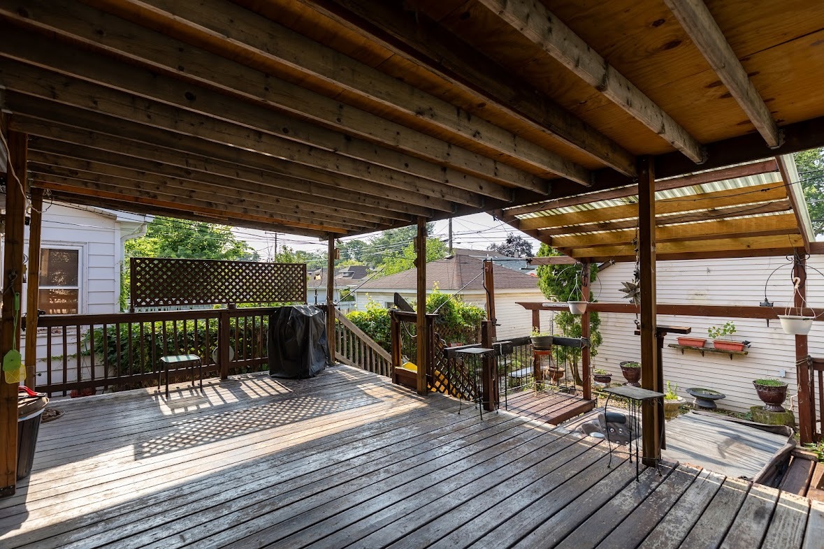 6840 29th Place Berwyn, IL 60402 - Photo 30 of 32 a view of a patio with table and chairs with wooden floor