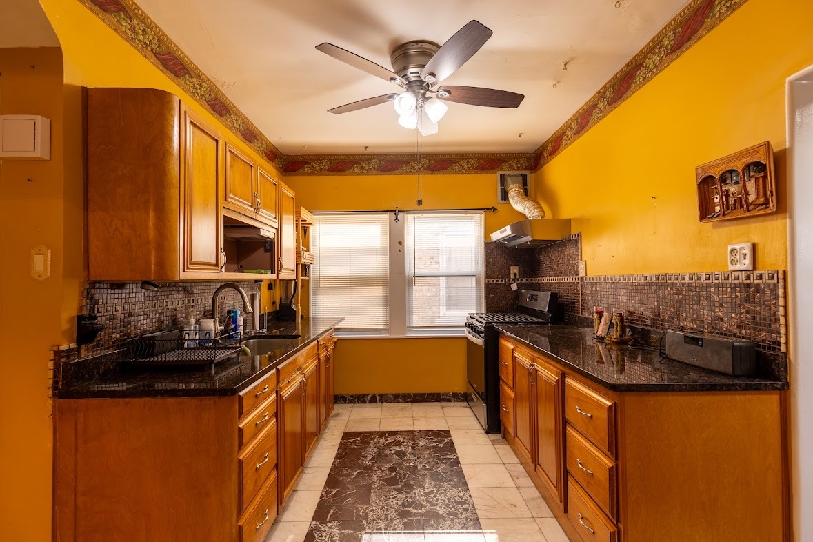 6840 29th Place Berwyn, IL 60402 - Photo 4 of 32 a kitchen with a sink stove and refrigerator
