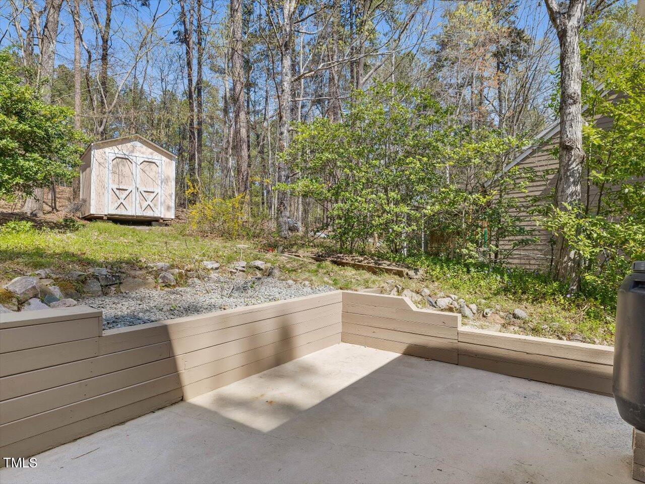 4818 Glendarion Drive Durham, NC 27713 - Photo 21 of 44 a view of a dry yard with large trees